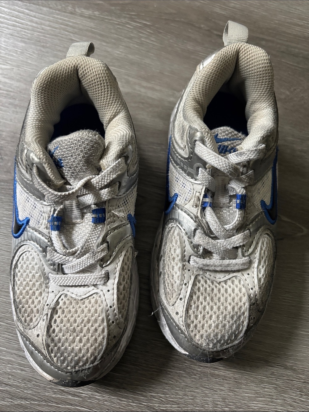Nike Kids White and Blue Sneakers size 11c, worn by active toddler boy